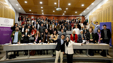 Group photo of students, judges, and organizers at the final round of the Youth Challenge to Alleviate Poverty competition at UC Chile.