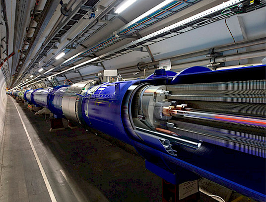 A section of CERN’s accelerator tunnel housing equipment for particle acceleration research.