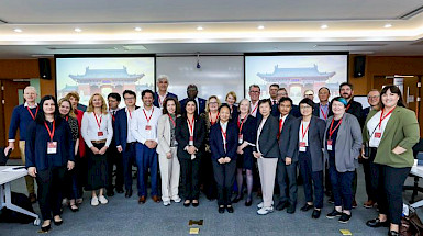 Group photo of participants at the Universitas 21 Annual Meeting, featuring academic and internationalization representatives from member universities in Shanghai, China.