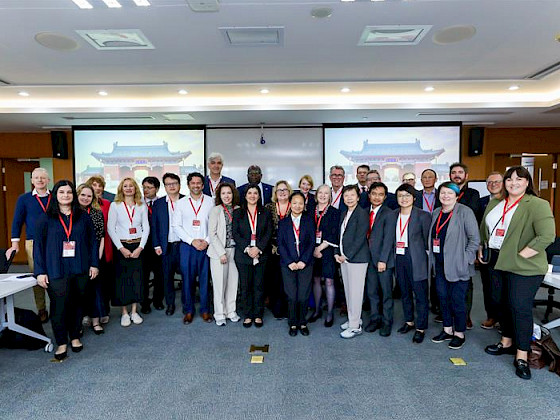 Group photo of participants at the Universitas 21 Annual Meeting, featuring academic and internationalization representatives from member universities in Shanghai, China.