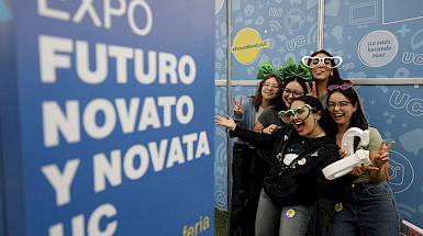 A group of students at the UC Chile Future Freshman Expo posing with playful accessories and smiles. (Photo credit: UC Chile)